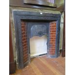 A Victorian cast iron fire surround with leaf decorated hood and brown glaze tiles, 96.5cm high,