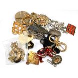 A bag of mixed costume brooches