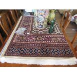 *A Bokhara style carpet, with sand field and seven rows of guls in a multiple border, 199 x 284cm