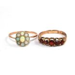 A five stone garnet ring together with an opal cluster ring