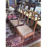 Two George III elm carver dining chairs, with pierced vase shape splats and square legs joined by