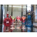 An Edwardian blue etched glass claret jug, with silver plated mounts, a cranberry glass decanter and