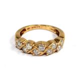 An 18 carat gold ring set with 10 diamonds