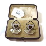 A pair of silver menu holders for Oriel College Oxford, boxed, 1904, retailed by Powell of Oxford