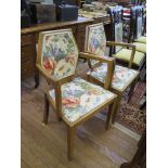 A pair of walnut Art Deco style carver dining chairs, the hexagonal upholstered backs above drop-