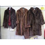 A mink full length fur coat, and two others