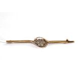 A gold bar brooch set with a rose diamond flower head