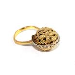 A gold colour metal ball ring, set with 14 diamonds