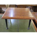 A 1960s teak rectangular coffee table with ebonised splayed dansette legs and brass feet 40cm x 30cm