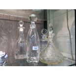 Four various cut glass decanters, one being a ship's decanter with the stopper engraved with a ship