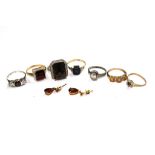 A small collection of seven fashion rings, and a pair of garnet earrings