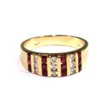A 14 carat gold ring set with lines of alternating rubies and diamonds