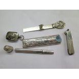 A collection of silver collectables to include a silver cased pair of scissors, a silver comb case