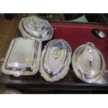 A collection of four silver plated entree dishes