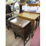 A carved oak chest of three drawers on turned legs 45cm wide, a table with barleytwist legs, and