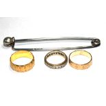 A 22 carat gold wedding ring, an 18 carat gold wedding ring, etc, and a kilt pin