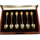 A boxed set of John Pinches commemorative spoons