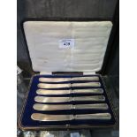 A boxed set of tea knives