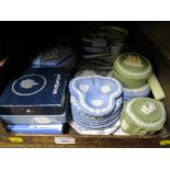 A collection of Wedgwood blue and green jasperwares, including a desk clock, mostly small dishes,