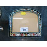 An Italian micro mosaic photo frame with inlaid floral decoration and rounded top, aperture size