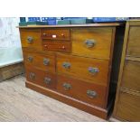 A walnut chest of drawers, the two shallow drawers flanked by deep drawers above four short