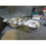 A pair of large silver plated sauce boats