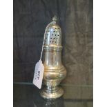 A silver sugar shaker