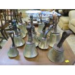 A set of fourteen brass handbells, stamped Mears, with leather straps, including correspondence from