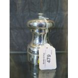 A silver capstan style pepper grinder, 10cm tall, London 1982