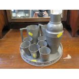 A Swatow Yimkee pewter drinks set comprising cocktail shaker, six shot glasses and a tray, with