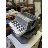 A Modello Francesco accordian, with green marbled effect case, 2.5 octave keyboard, 24 stops