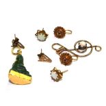Three pairs of earrings to include an opal pair, a small carved Buddha and a gold colour treble