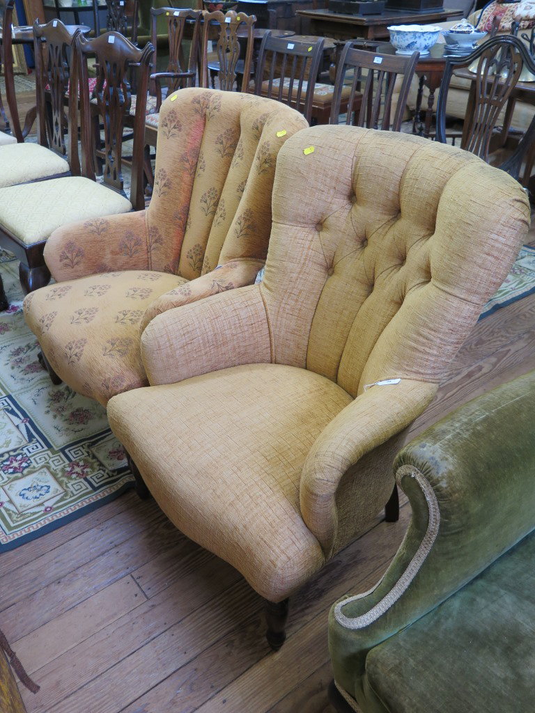 A reproduction Victorian style button back fireside chair on turned legs and another similar (2)