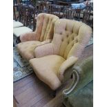 A reproduction Victorian style button back fireside chair on turned legs and another similar (2)