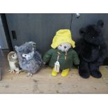 A Paddington Bear dressed in yellow and green 51cm high, two Hamleys soft owls and a limited edition