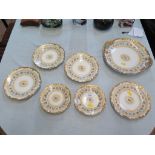 Four Limoges daisy pattern sde plates, marked T and V, 18.5cm diameter, a serving plate and two