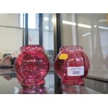 A pair of Victorian cranberry glass posy vases with crimped edge detail, 9cm high