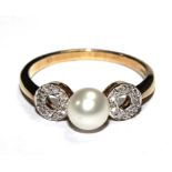 A pearl and diamond three stone ring