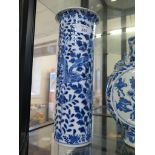 A Chinese blue and white cylindrical vase, depicting dragons among chrysanthemums, (chip and
