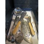 Nine various silver plated flatware items including fish servers, ladle, butter knife, tongs etc