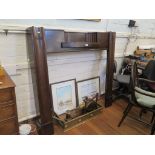 A 1920s mahogany mantelpiece, with inset shelf and moulded supports, 135cm wide