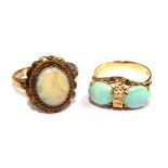 Two 14 carat gold rings set with opals (2)