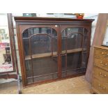A Victorian mahogany bookcase top, the part protruding cornice over a pair of glazed doors, 161cm