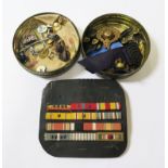 A collection of U.S. Marine Corps and other military badges and ribbons, a Marine Corps plaque and