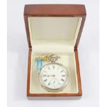 A silver key wind pocket watch with white enamel dial complate with key