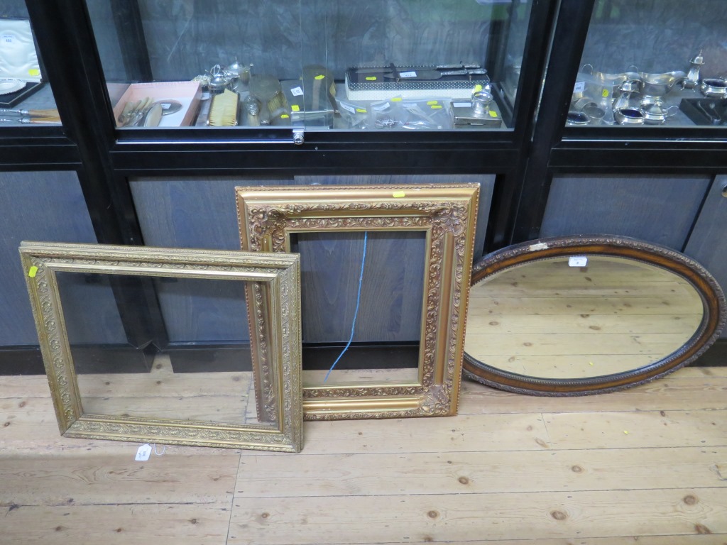 An oak oval wall mirror and two picture frames (3)