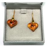 A pair of boxed Lalique amber earrings in the form of hearts