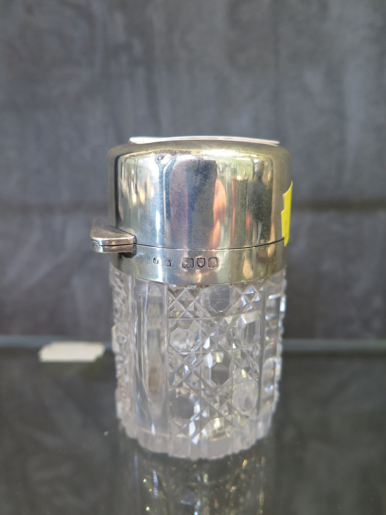 A silver toilet bottle