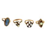 A collection of three 9 carat gold rings, set with opals, a forth set with opals and garnet