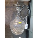 A glass claret jug with silver plated mounts 25.5cm high